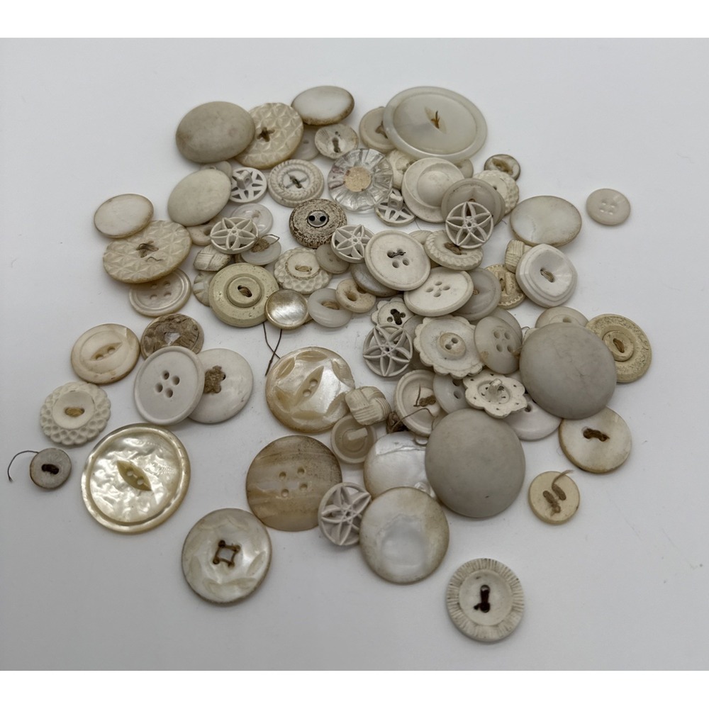 Vintage lot of retro white ivory buttons for fashion crafts.